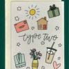 Close up of a white greeting card on top of a cream-colored envelope, all on a forest background. The card reads, "Type two” written with drawings of flowers, present, cozy robe, mail, house, and a sun