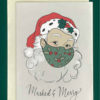 Close-up of a white greeting card on top of a cream-colored envelope, all on a forest green background. The card features a colored, vintage style drawing of Santa Claus wearing a holly-printed face mask. Underneath in script reads, "Masked & Merry"