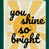image of a greeting card that reads "you shine so bright" in bold, black cursive font in front of a geometric sun on a light blue background