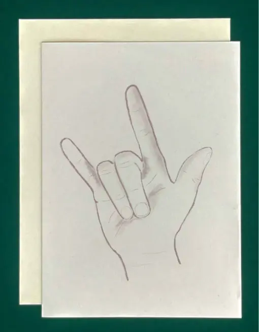 Close-up product shot of a greeting card that features a pencil drawing of a hand signing "I Love You" in American Sign Language